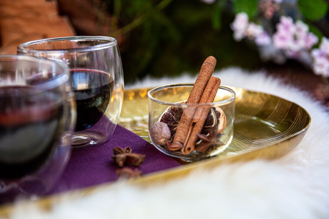 two glasses of mulled wine on a tray